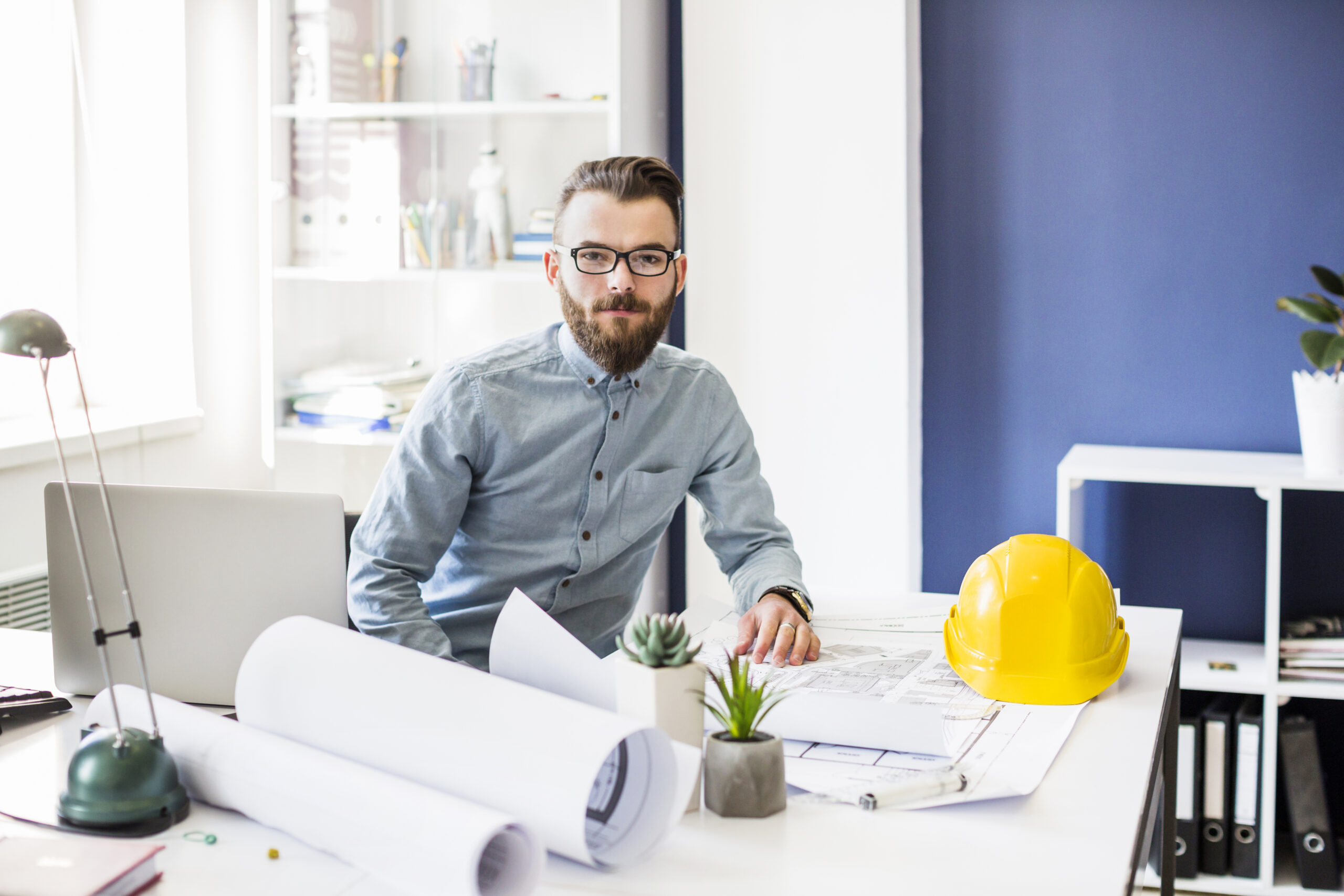 portrait-young-male-architect-office