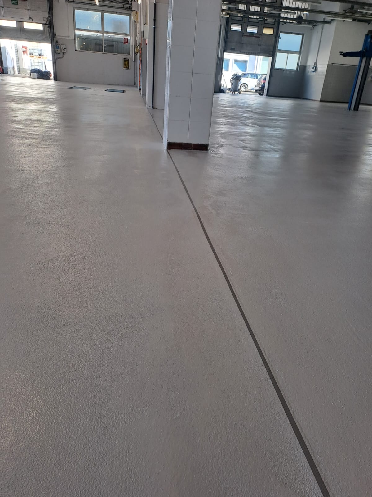 Resin flooring for car dealerships with garages.